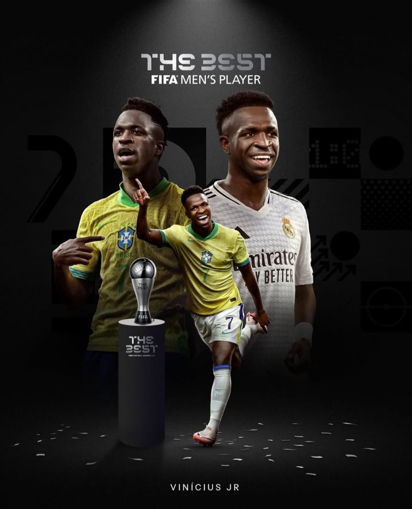 Vinícius Jr. recebendo o prêmio de melhor jogador do mundo pela FIFA.
